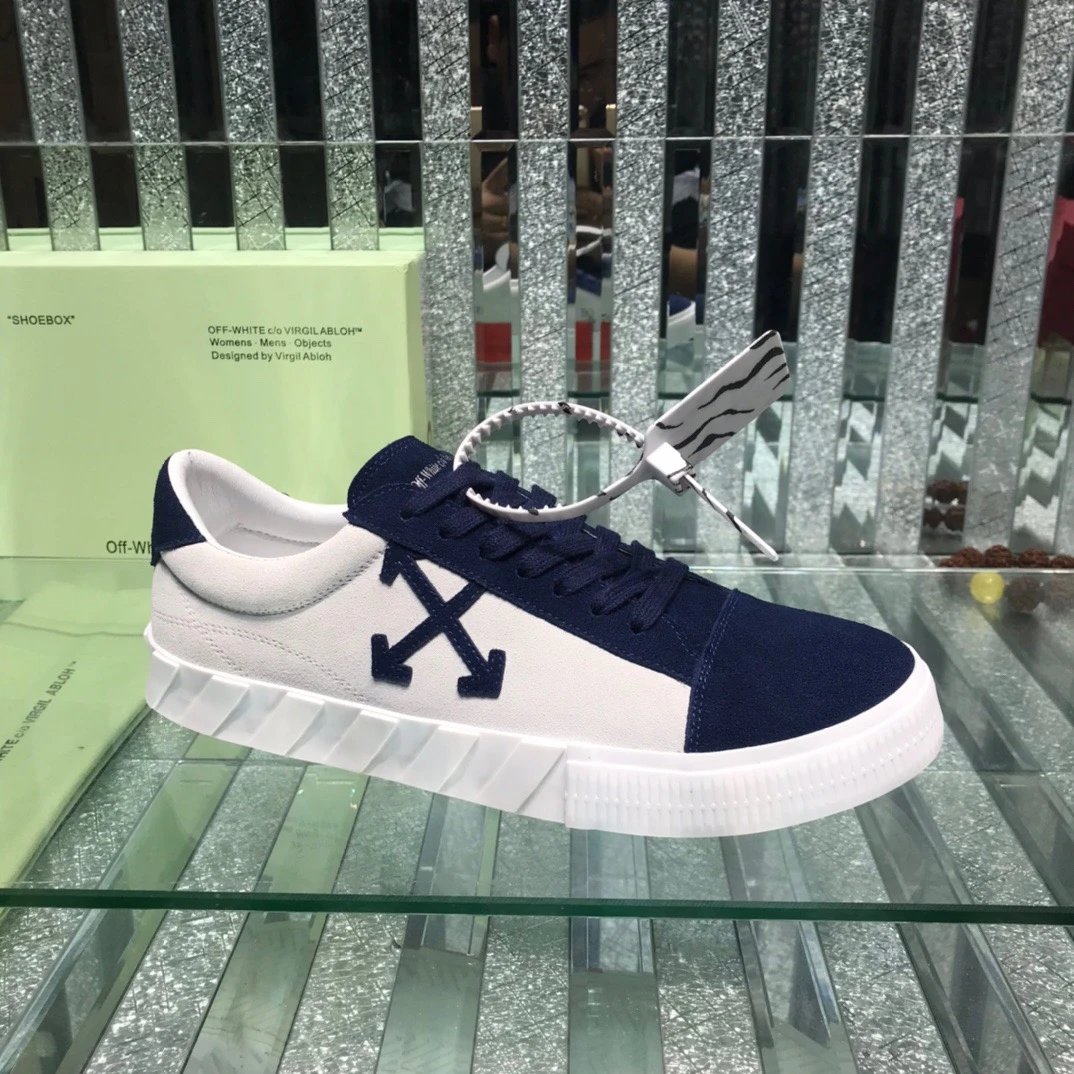 ShoesOff White Arrow Logo Leather Low Top Sneakers