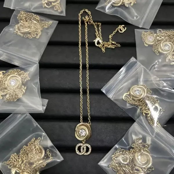 Chanel CC Swirl Pendant Necklace Gold Jewelry - 1