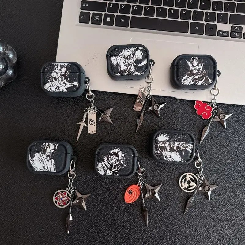 black silicone AirPods case with manga-style character print and metal ninja weapon keychain — SB001293 listing image