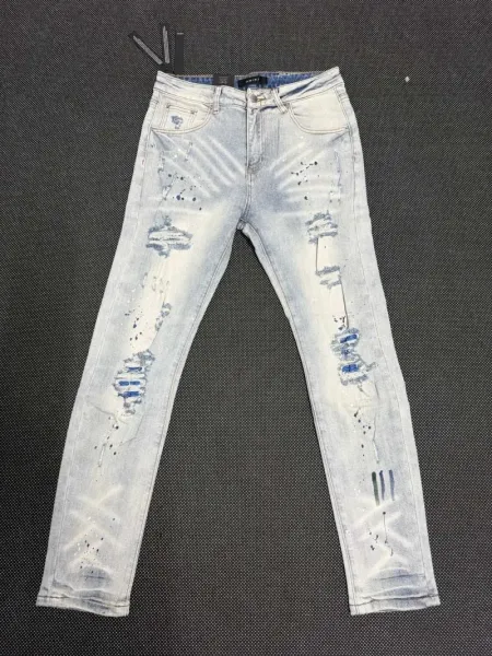 Amiri Distressed Paint-Splatter Light Wash Jeans - 1