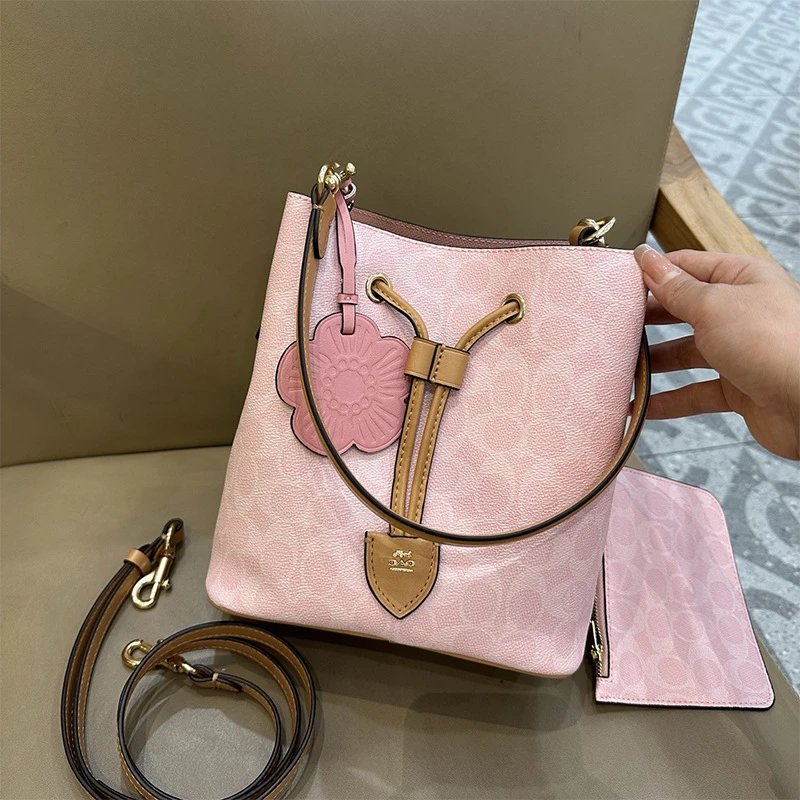 Coach Mini Bucket Bag Pink Leather with Floral Charm Handbags