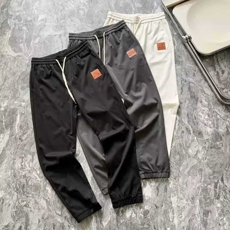 Smiley Face Embroidered Cupro Long Pants