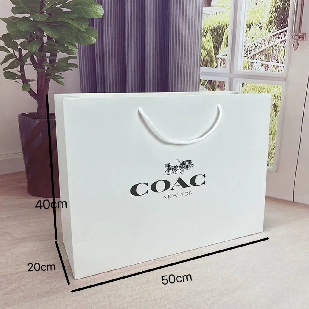 White plus large handbag, 50 * 40 * 20cm, comes with a complimentary novel