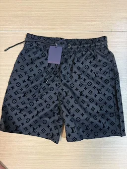 thumbnail for Water-reactive patterned beach shorts