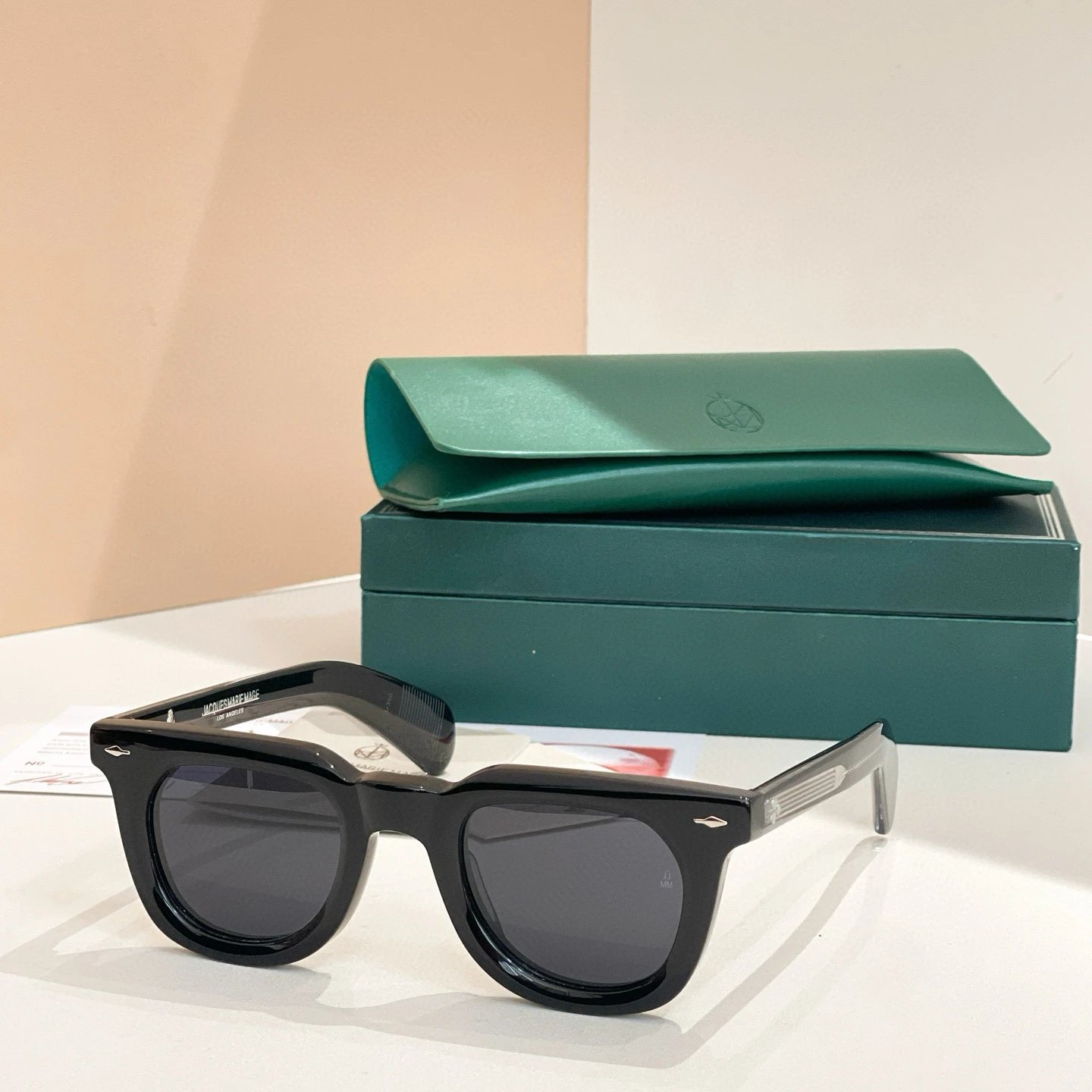 Black and silver framed gray mirror