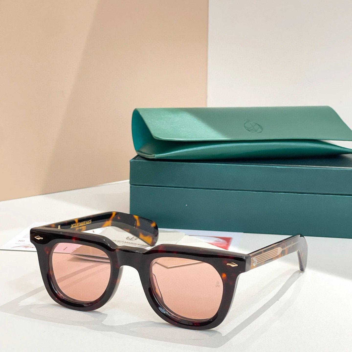 Tortoiseshell gold framed pink glasses