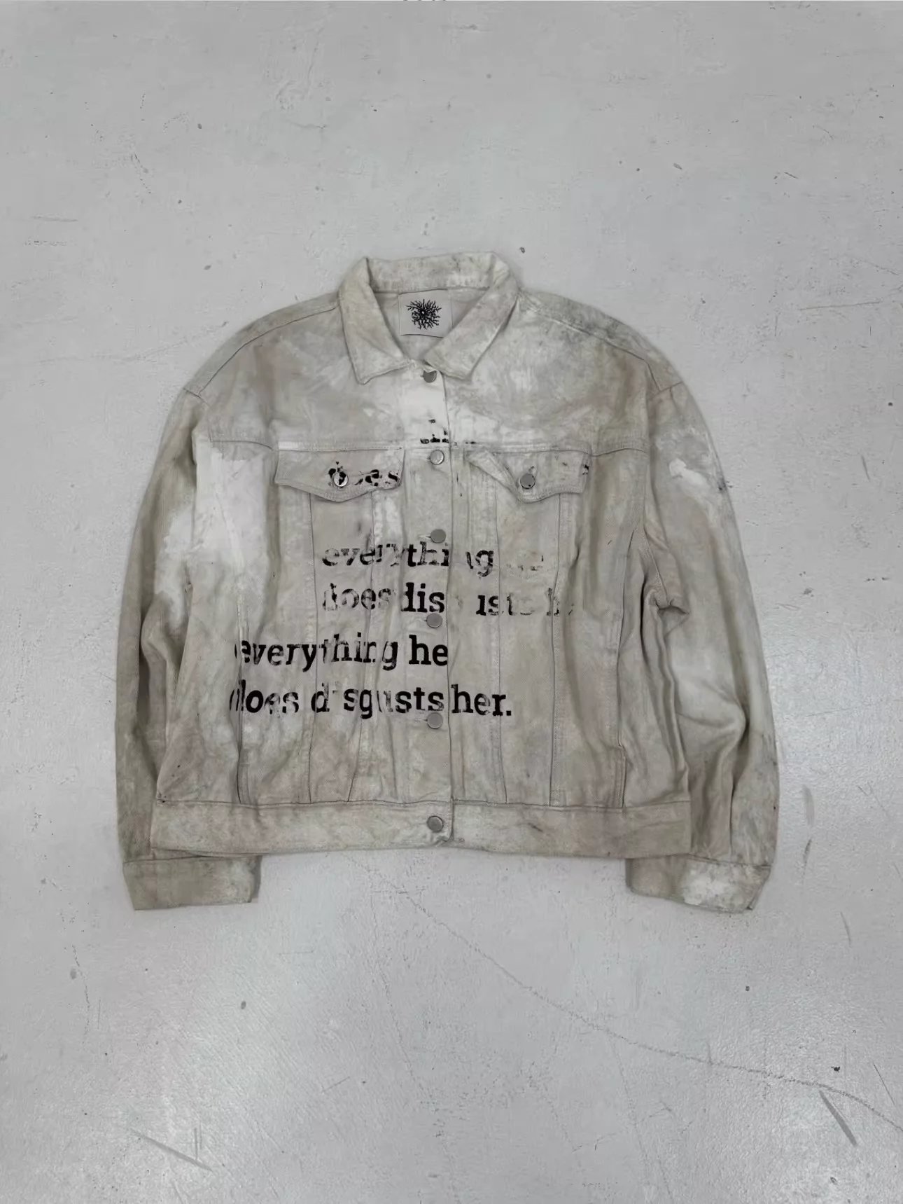 Cool-toned, Distressed, And Washed-out Jacket With Printed Slogans.