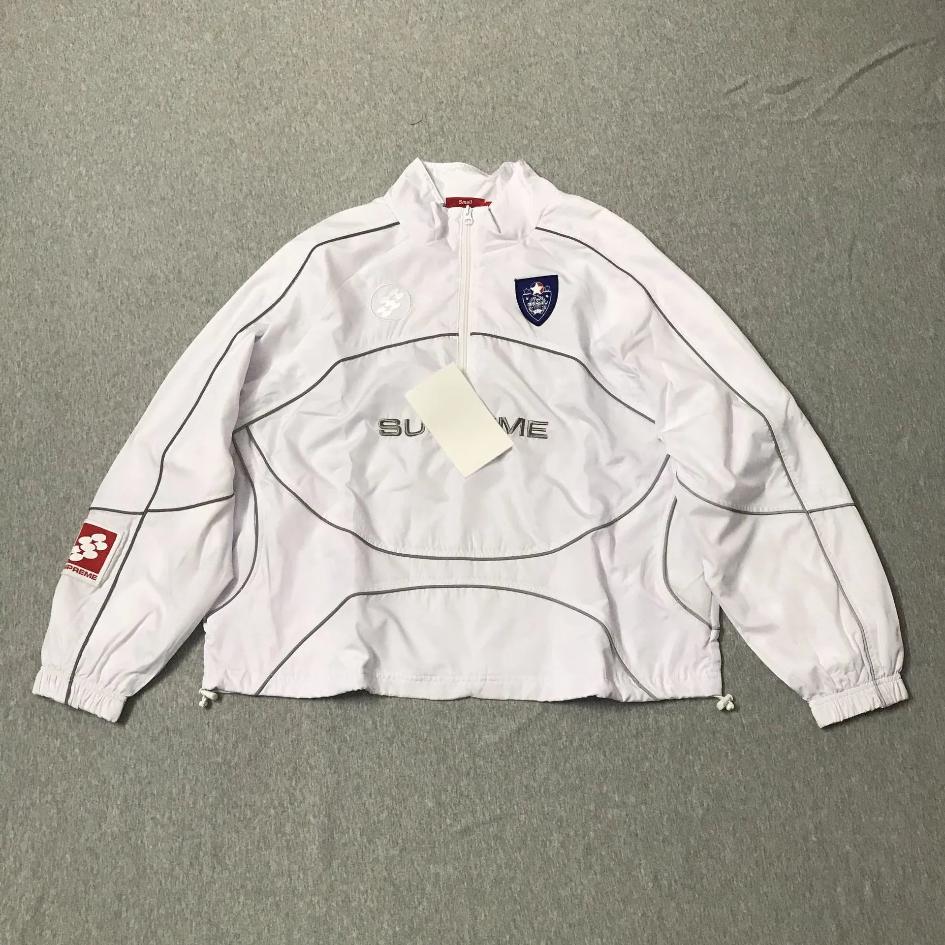 Supreme Jackets Hooded color-block logo-print jacket — 9000 White Top