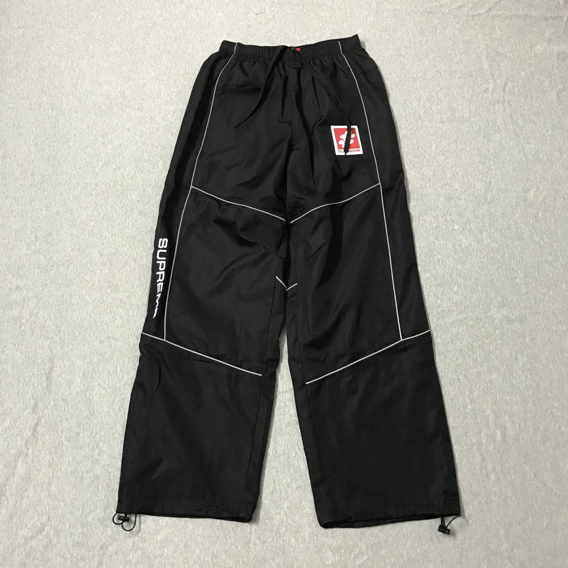 Supreme Jackets Hooded color-block logo-print jacket — 9000 Black Trousers