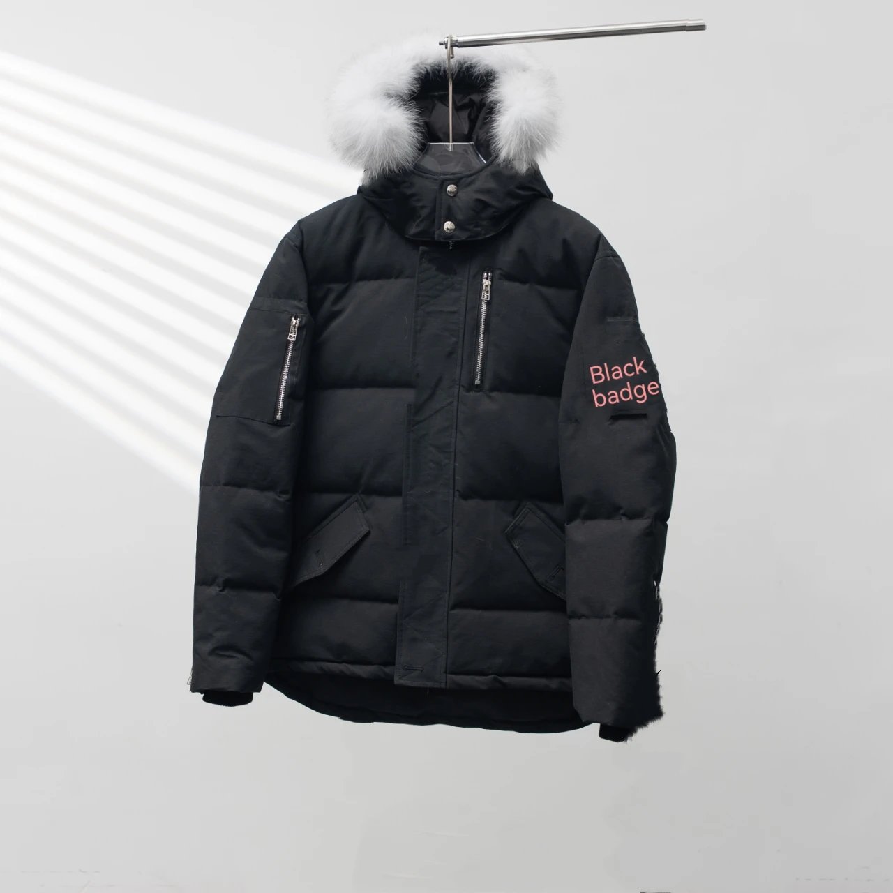 Black badge, white fur