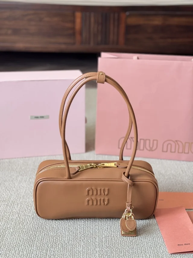 Miu Handbags Logo-Embossed Zip-Top Handbag product detail image 39