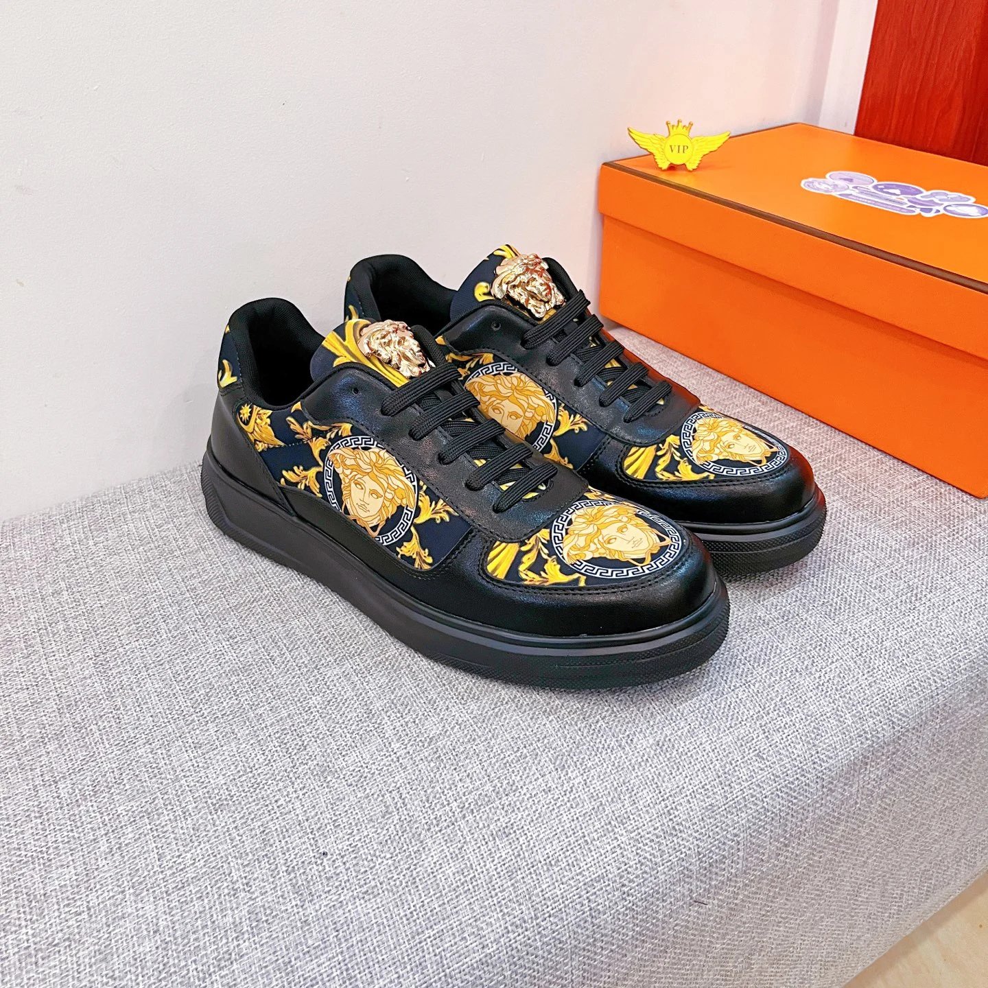 Baroque Leather Sneakers Black Gold with golden Baroque Medusa motifs - Gallery Image 1 - Detailed View