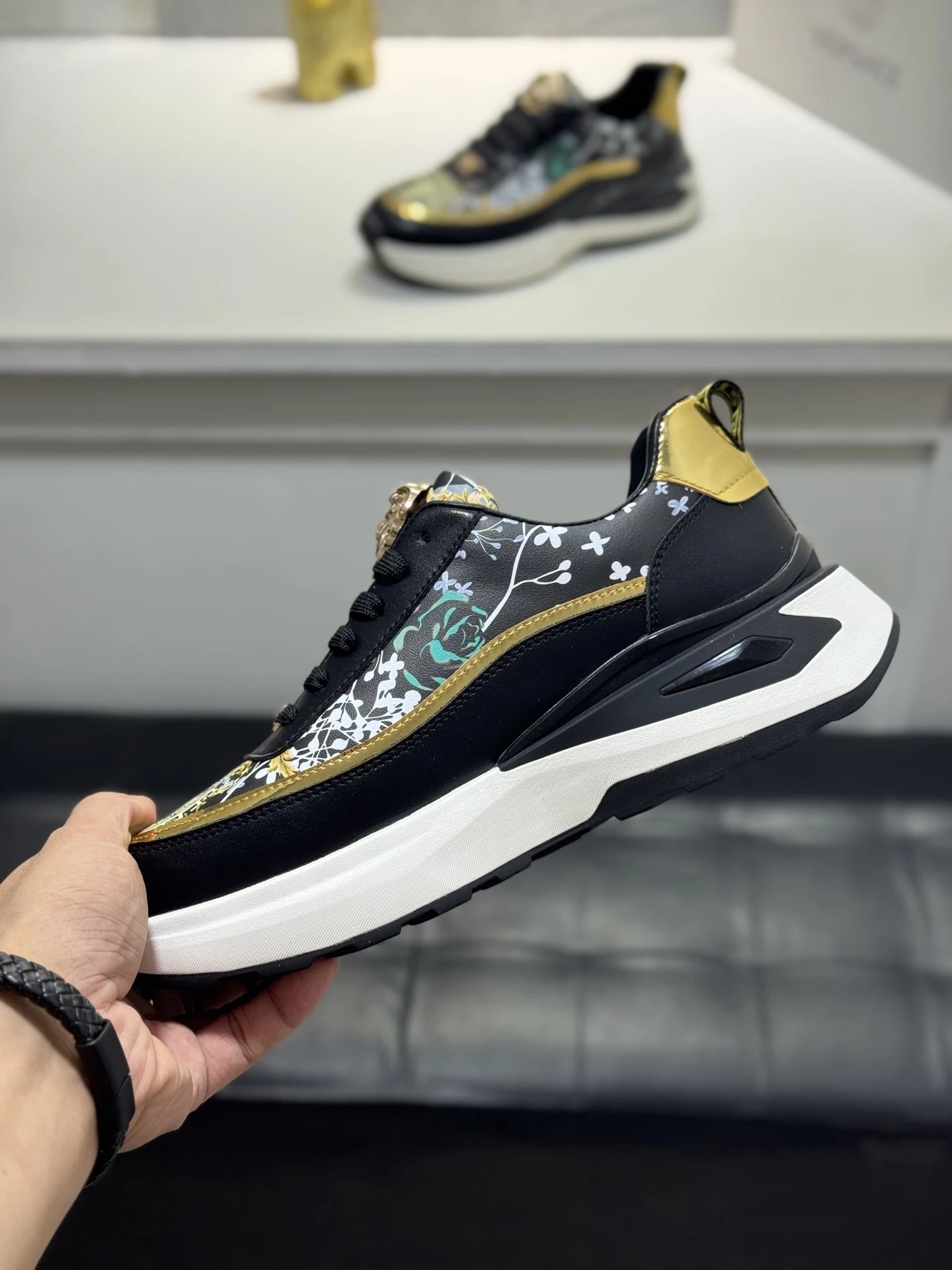Luxury Leather Medusa Sneakers Black Gold - Gallery Image 6 - Detailed View