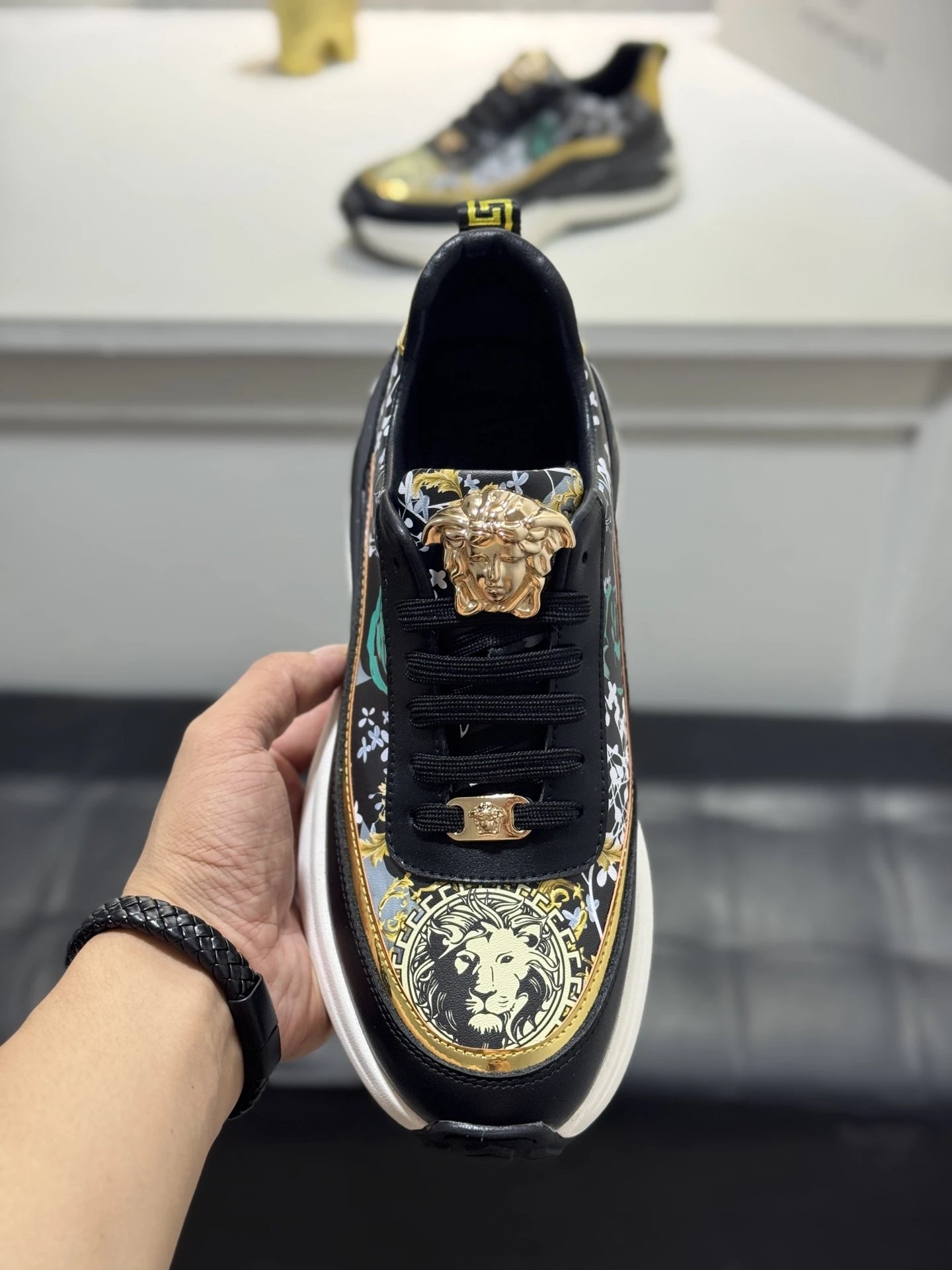 Luxury Leather Medusa Sneakers Black Gold - Gallery Image 5 - Detailed View