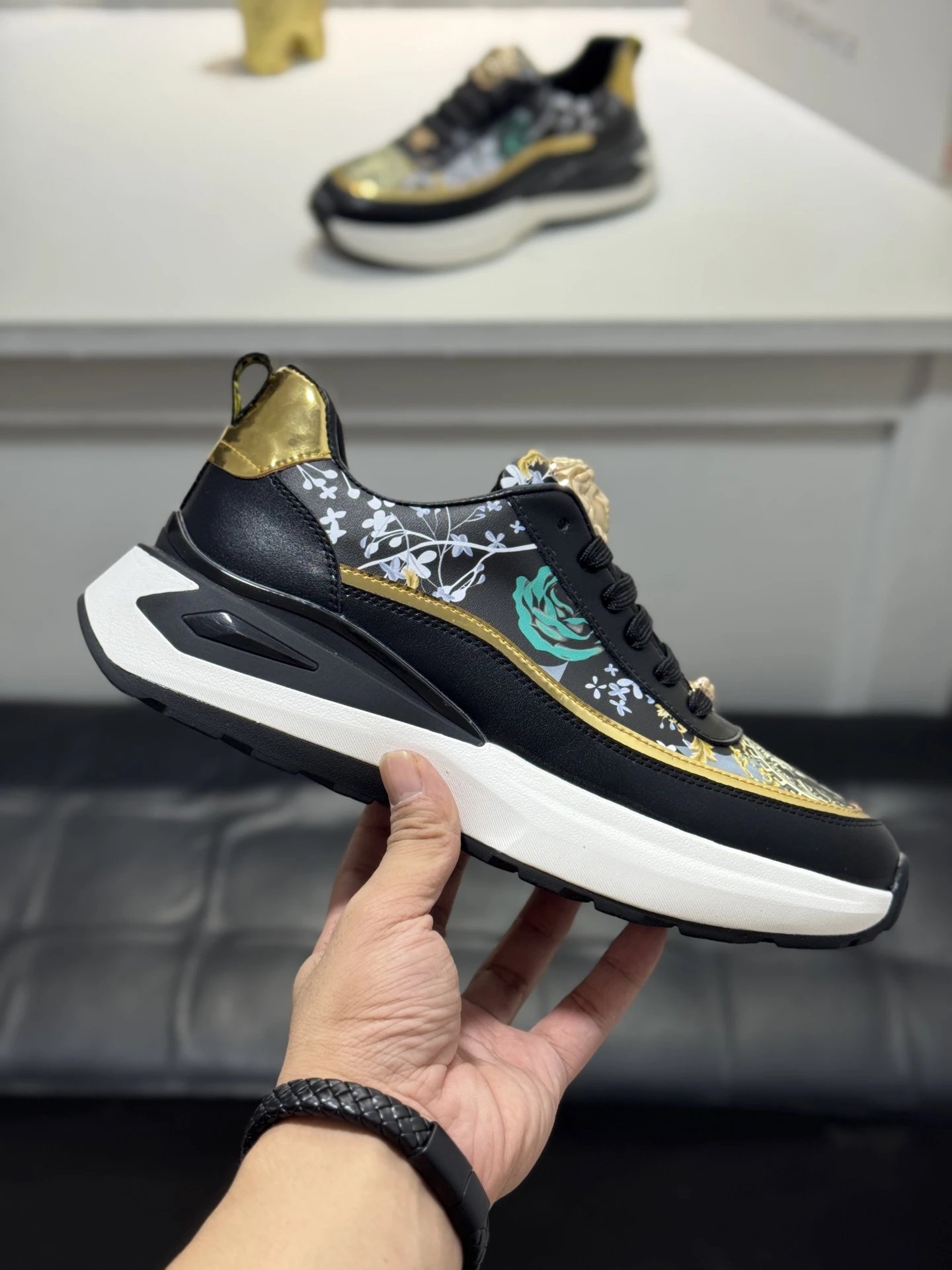 Luxury Leather Medusa Sneakers Black Gold - Gallery Image 4 - Detailed View
