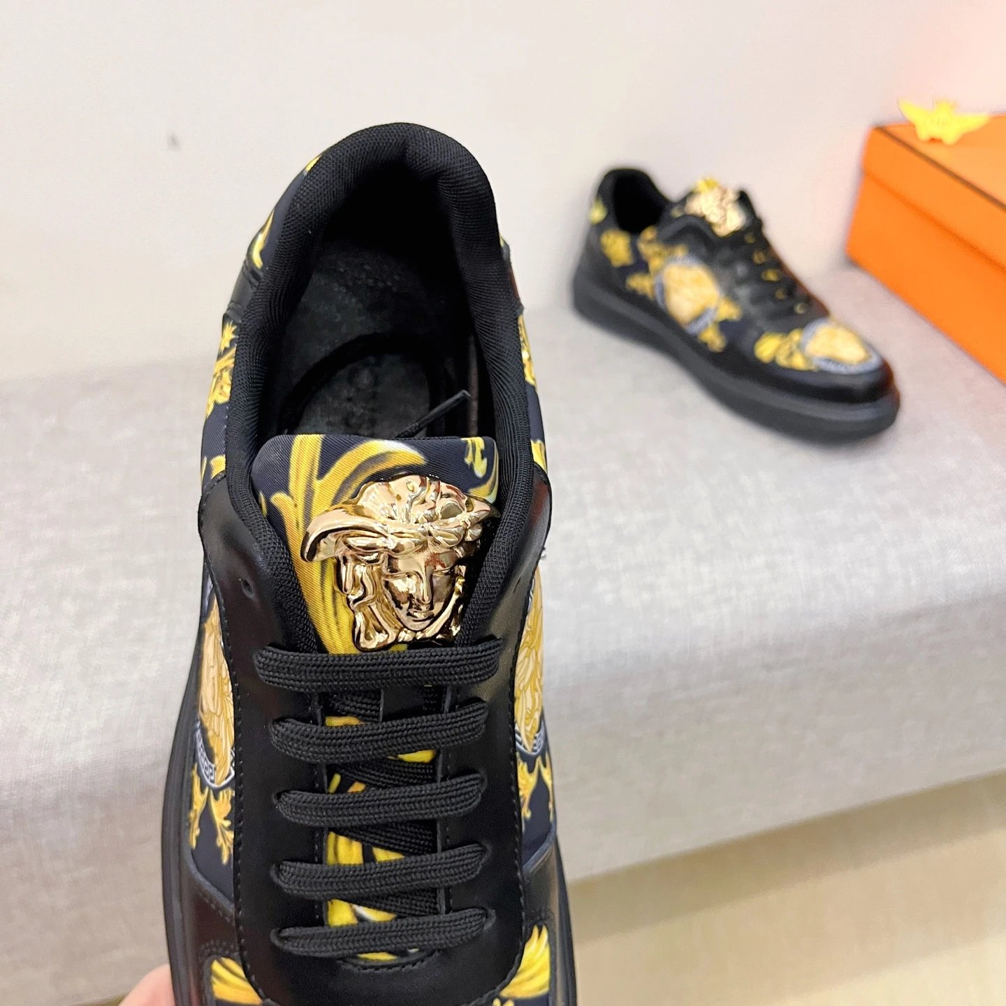 Baroque Leather Sneakers Black Gold with golden Baroque Medusa motifs - Gallery Image 7 - Detailed View