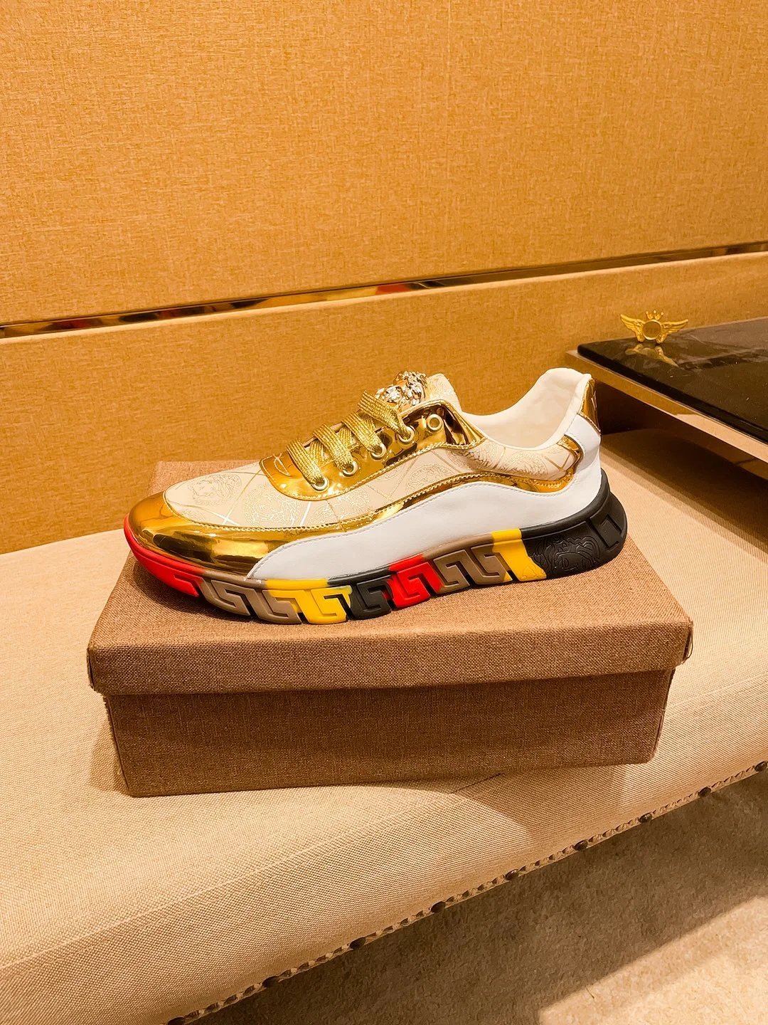 Luxury Leather Sneakers with Medusa Detail in Metallic Gold - Gallery Image 6 - Detailed View