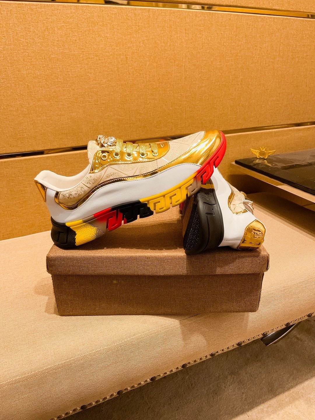 Luxury Leather Sneakers with Medusa Detail in Metallic Gold - Gallery Image 2 - Detailed View