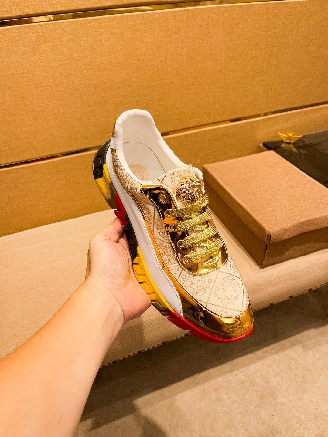 Luxury Leather Sneakers with Medusa Detail in Metallic Gold - Gallery Image 7 - Detailed View