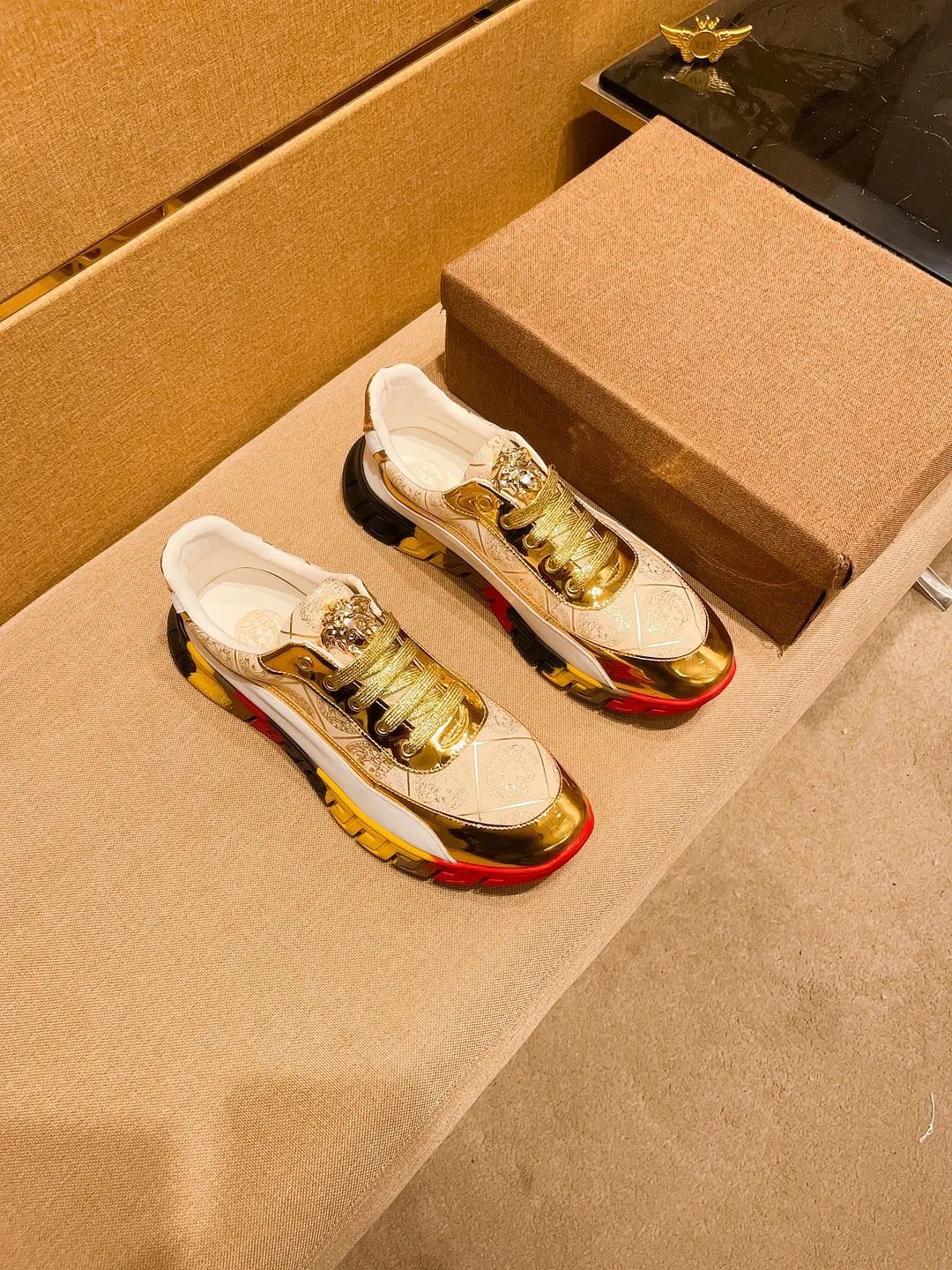 Luxury Leather Sneakers with Medusa Detail in Metallic Gold - Gallery Image 5 - Detailed View