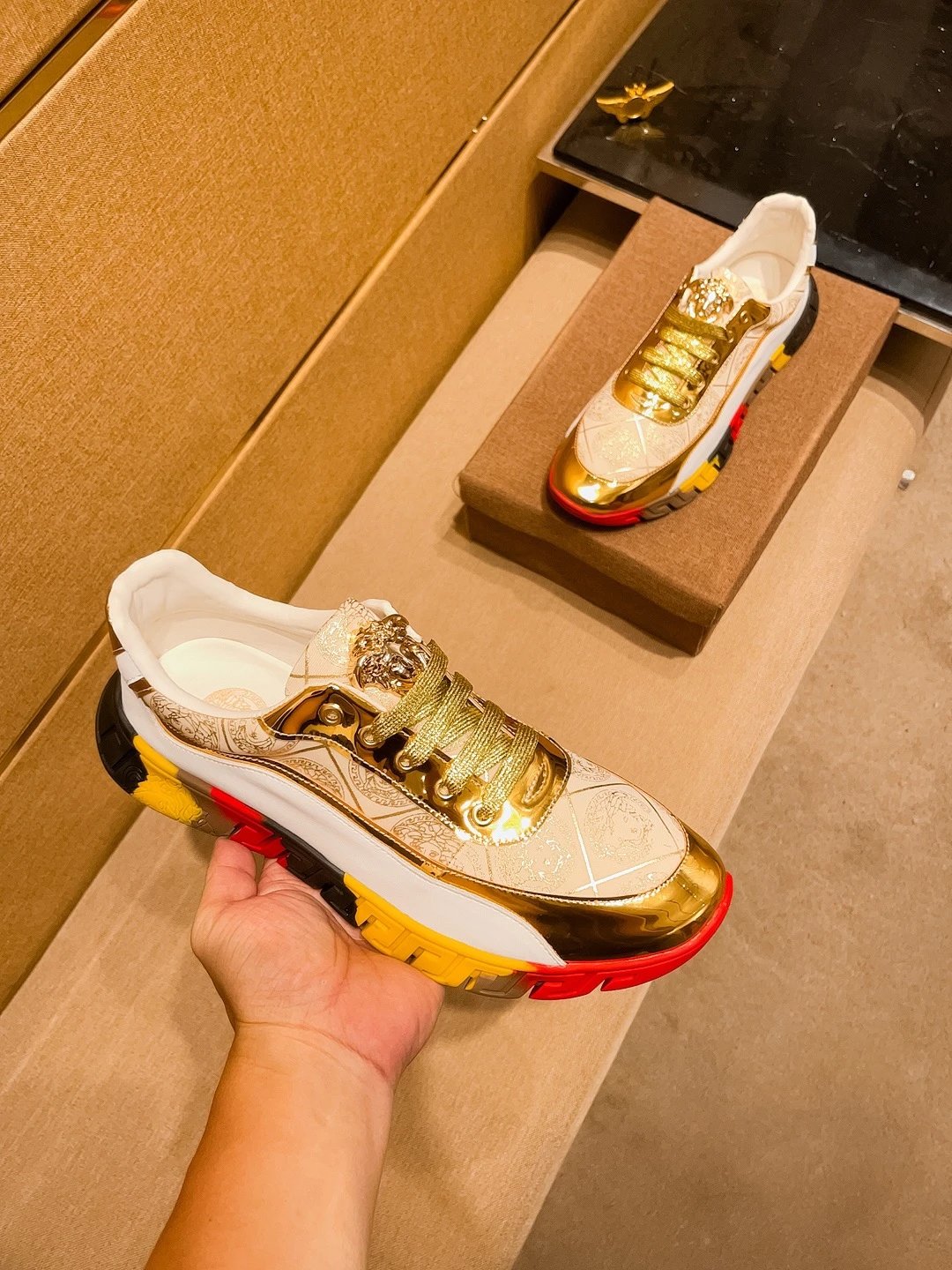 Luxury Leather Sneakers with Medusa Detail in Metallic Gold - Gallery Image 4 - Detailed View