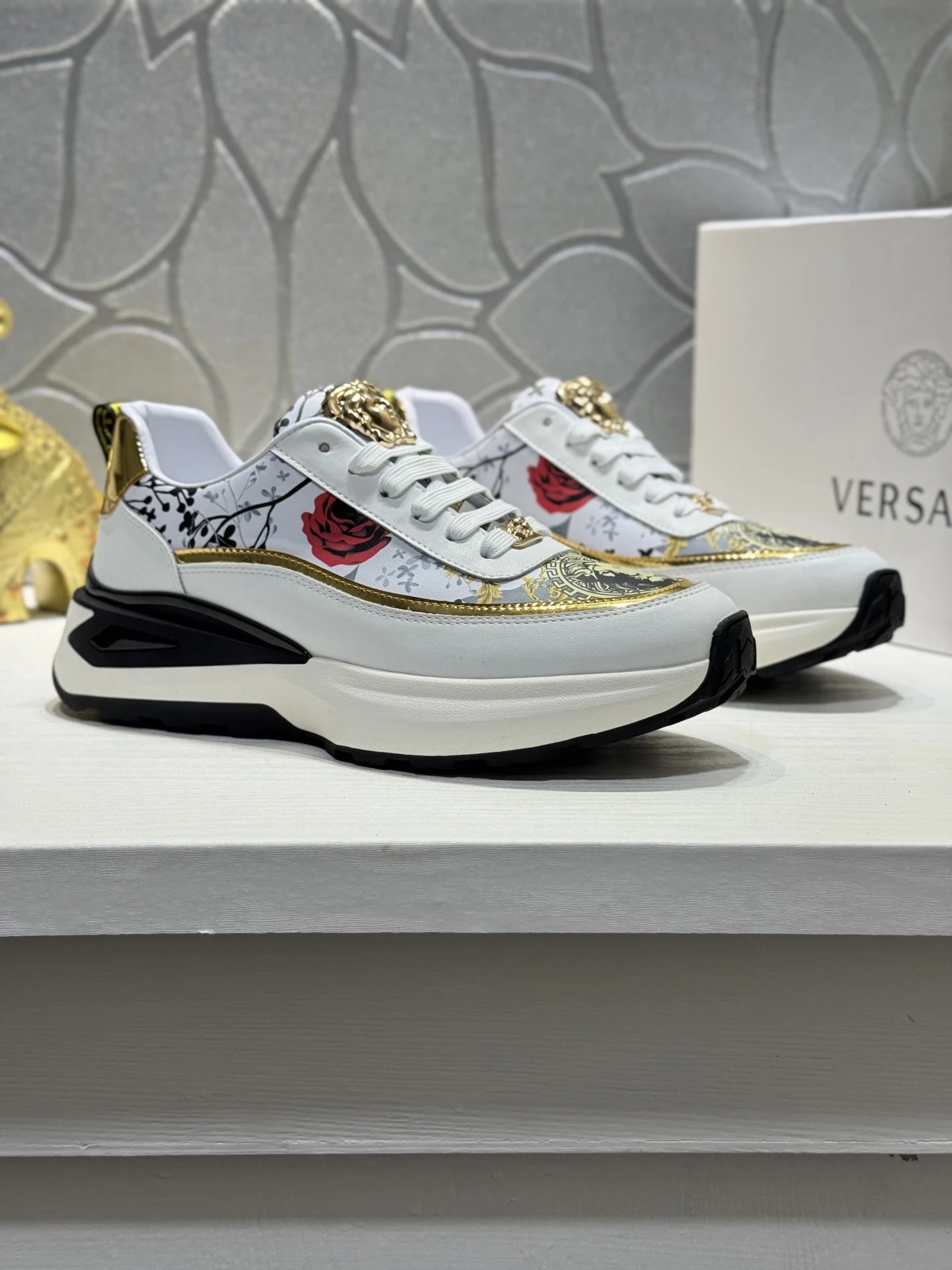 Luxury Leather Medusa Sneakers with Floral Accents White Gold - Gallery Image 1 - Detailed View