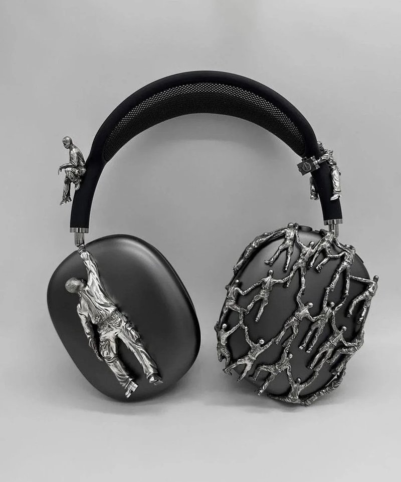 Black sculptural figure headphones