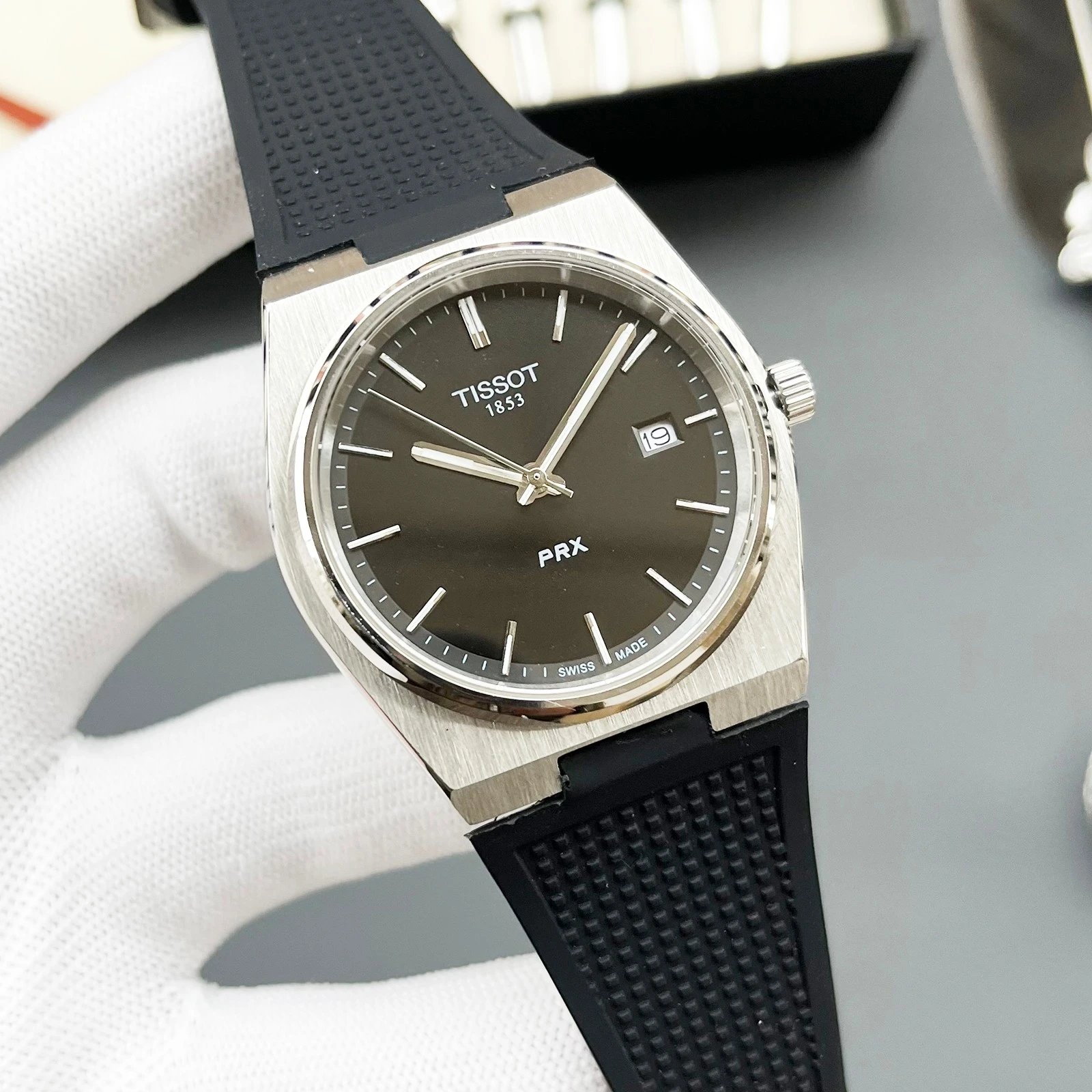 Silver case, Black dial, Black rubber strap