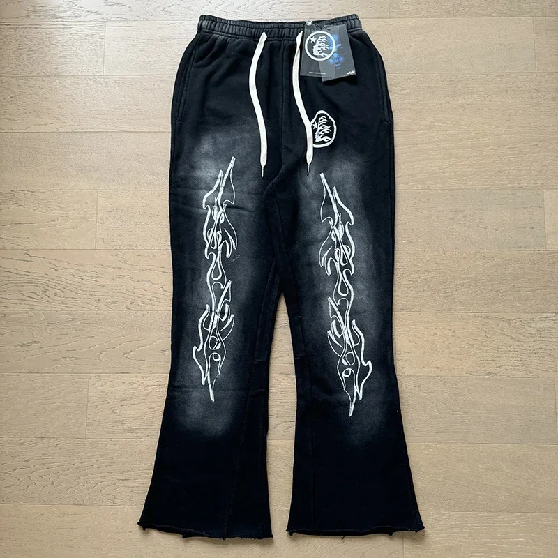 Hellstar Studios — Distressed Flared Sweatpants with Flame Motif
