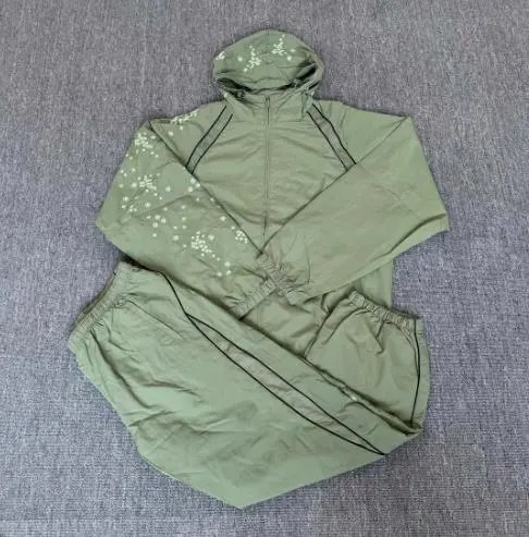 Supreme SS22 Week 3 AOI Glow-in-the-Dark Track Pants — green suit colorway — USFans Spreadsheet photo