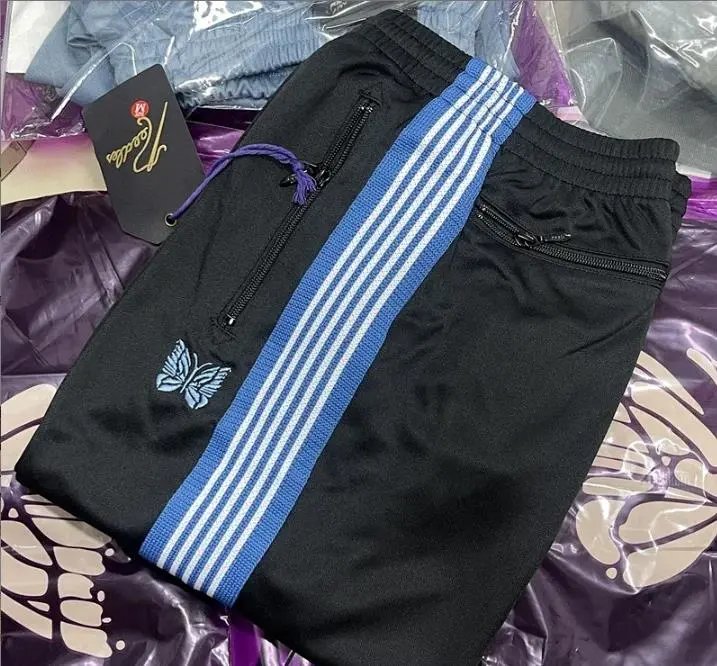 Needles-Inspired Black Track Pants with Butterfly Logo and Side Stripes