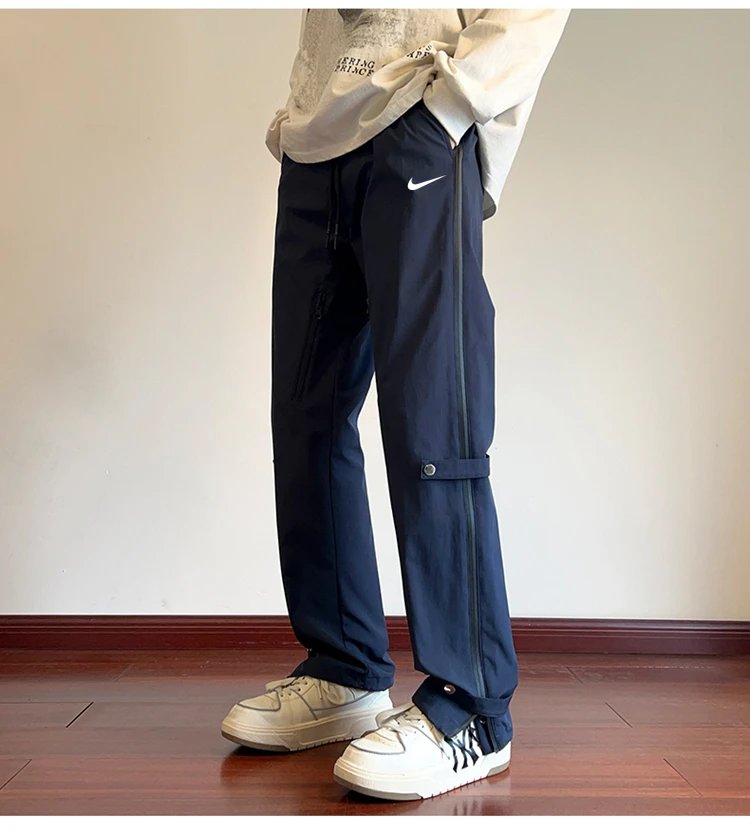 Nike-Inspired Burgundy Technical Pants with Zipper and Strap Details