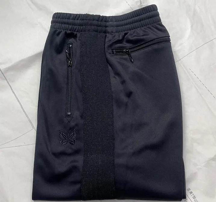 Needles-Inspired Black Track Pants with Butterfly Logo and Side Stripes