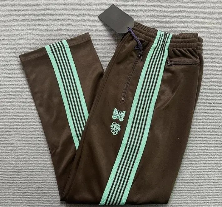 Needles-Inspired Black Track Pants with Butterfly Logo and Side Stripes