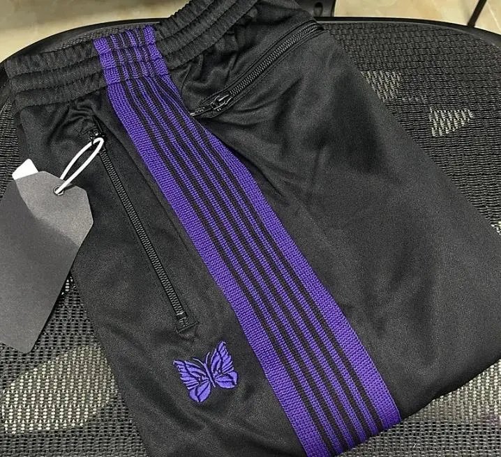 Needles-Inspired Black Track Pants with Butterfly Logo and Side Stripes