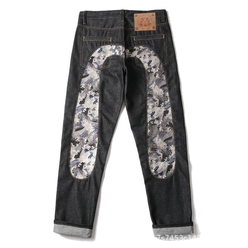 EVISU — Raw Selvedge Straight-Leg Jeans with Large "M" Print and Cuffed Hem - rep spodnie