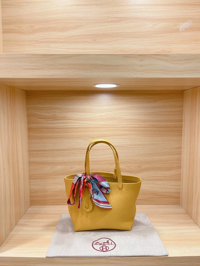 Hermès Handbags Pebbled Leather Tote Bag with Scarf Detail product detail image 1