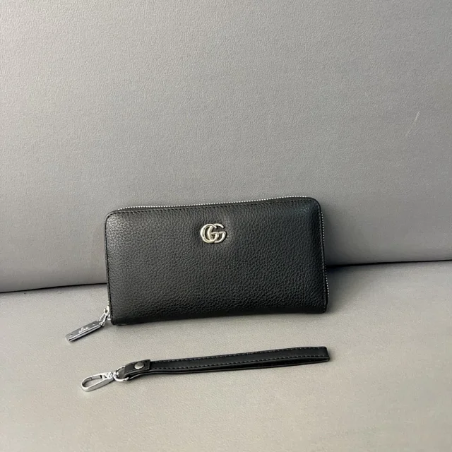Gucci Wallets & Card Holders Black zip-around wristlet wallet with embossed Double G design product detail image 1