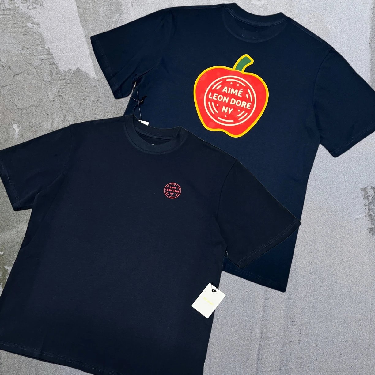Aimé Leon Dore T-Shirts Short-sleeve logo graphic T-shirt — Sapphire-blue lettered Apple A19