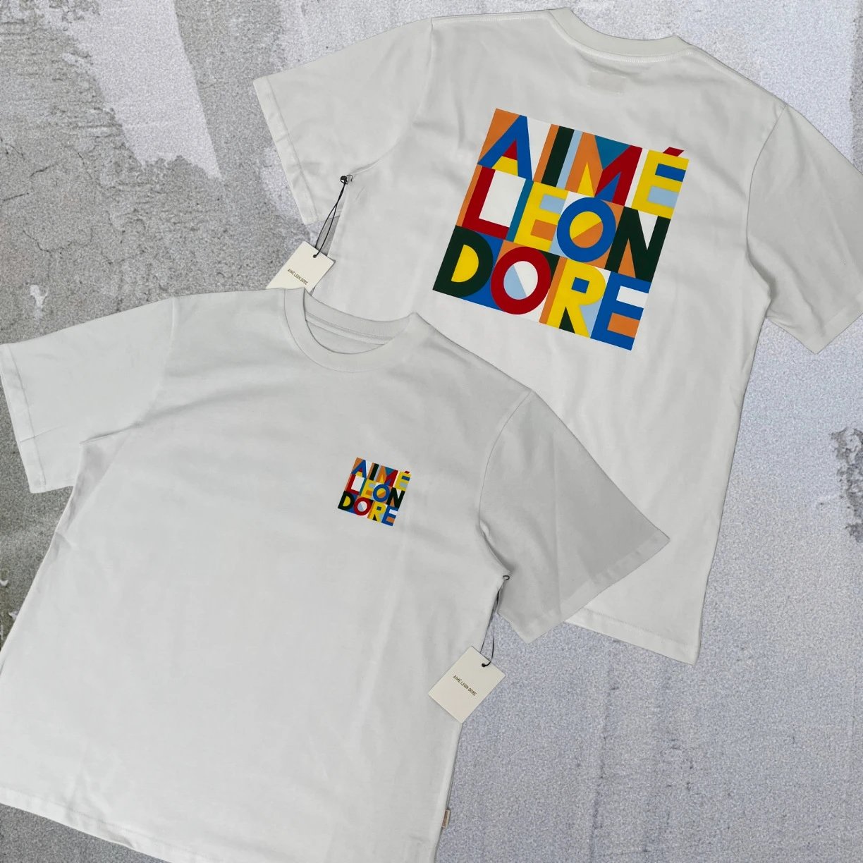 Aimé Leon Dore T-Shirts Short-sleeve logo graphic T-shirt — White Abstract Color Blocks A04