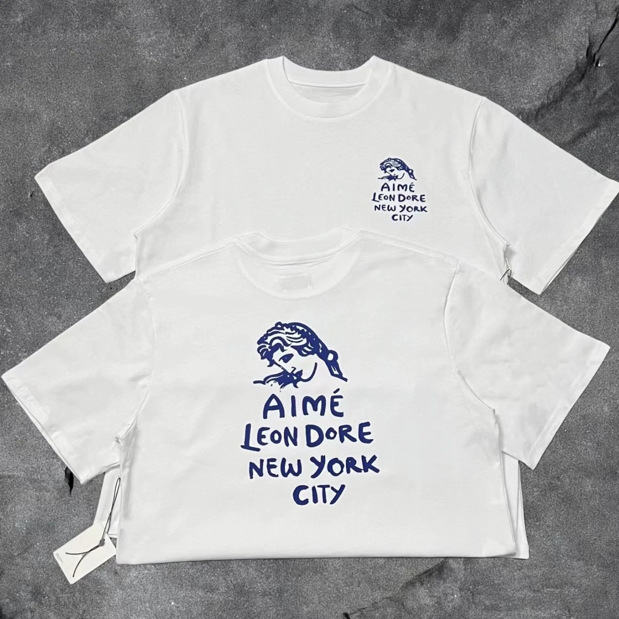 Aimé Leon Dore T-Shirts Short-sleeve logo graphic T-shirt — White Goddess A30