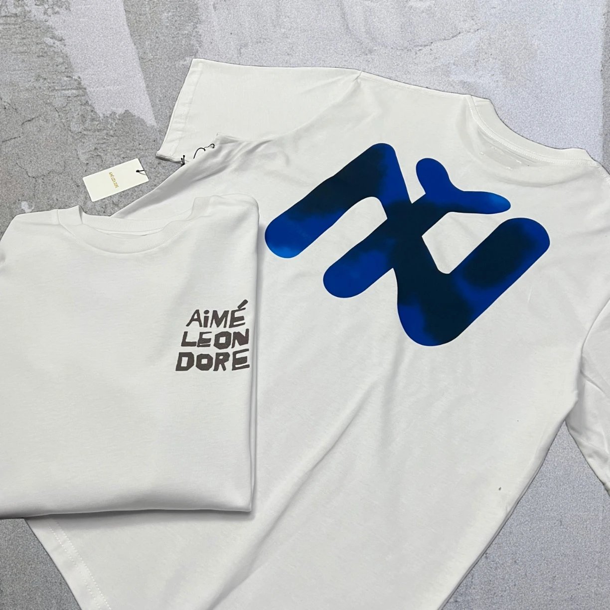 Aimé Leon Dore T-Shirts Short-sleeve logo graphic T-shirt — White NY A12