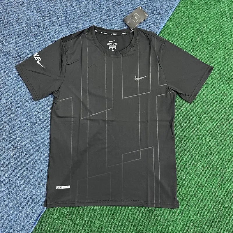 Nike T-Shirts Short-Sleeve Ankle Skeleton Graphic T-Shirt — Black short-sleeved shirt with vertical stripes