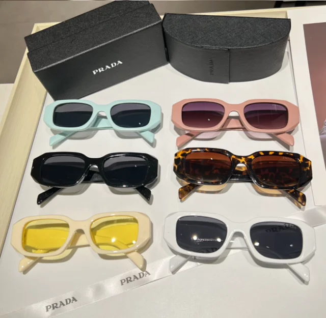Prada Eyewear Geometric-frame sunglasses with sculpted wide temples product detail image 1