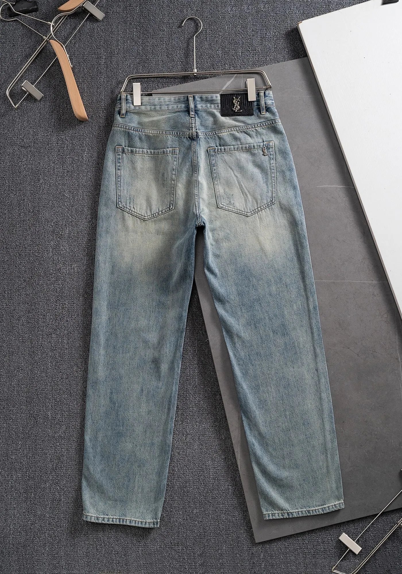 Saint Laurent Jeans High-rise denim with assorted washes and logo-pattern variants — 01