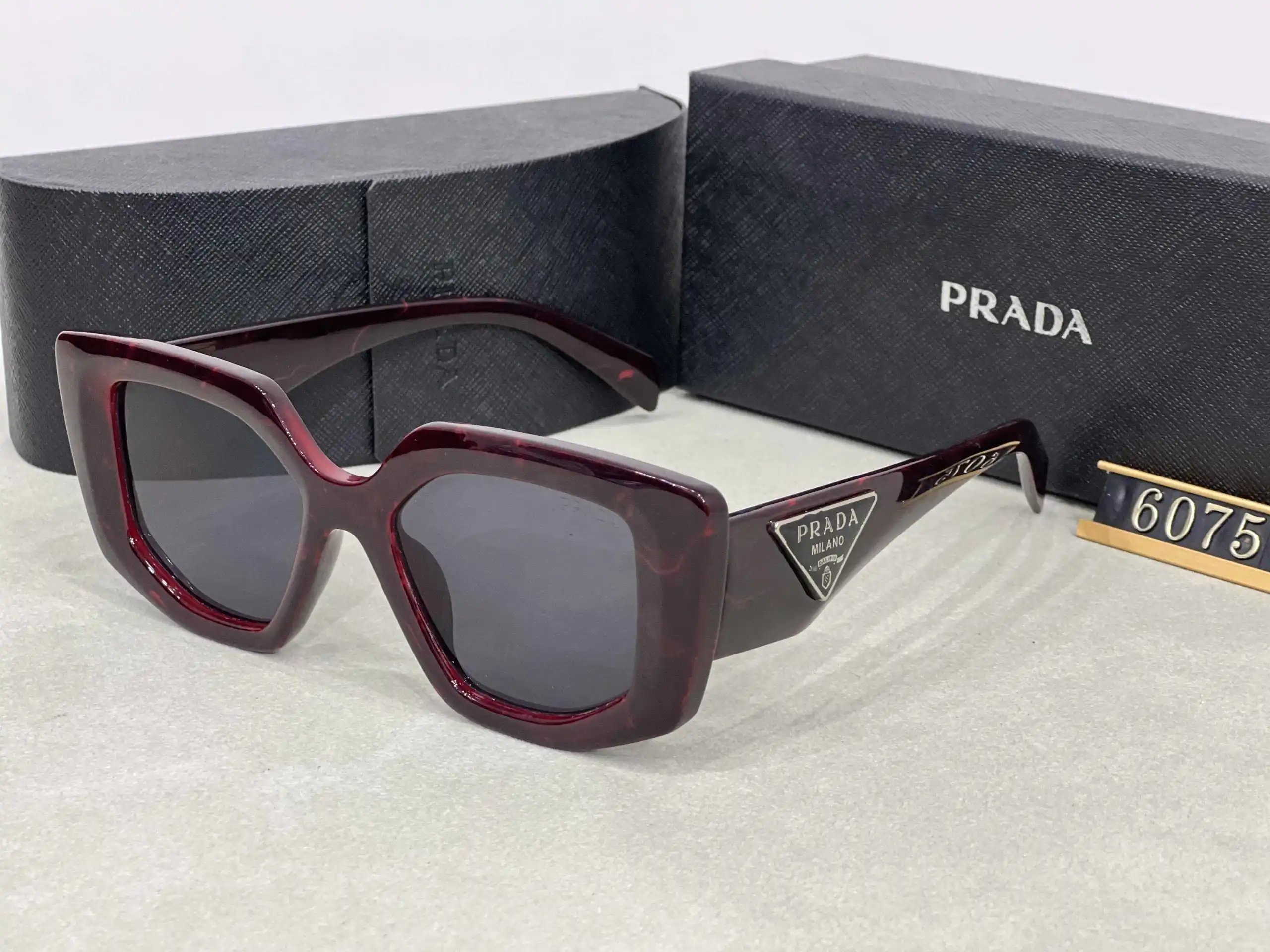 Prada Eyewear Assorted geometric-frame sunglasses with triangle logo plaques — 26