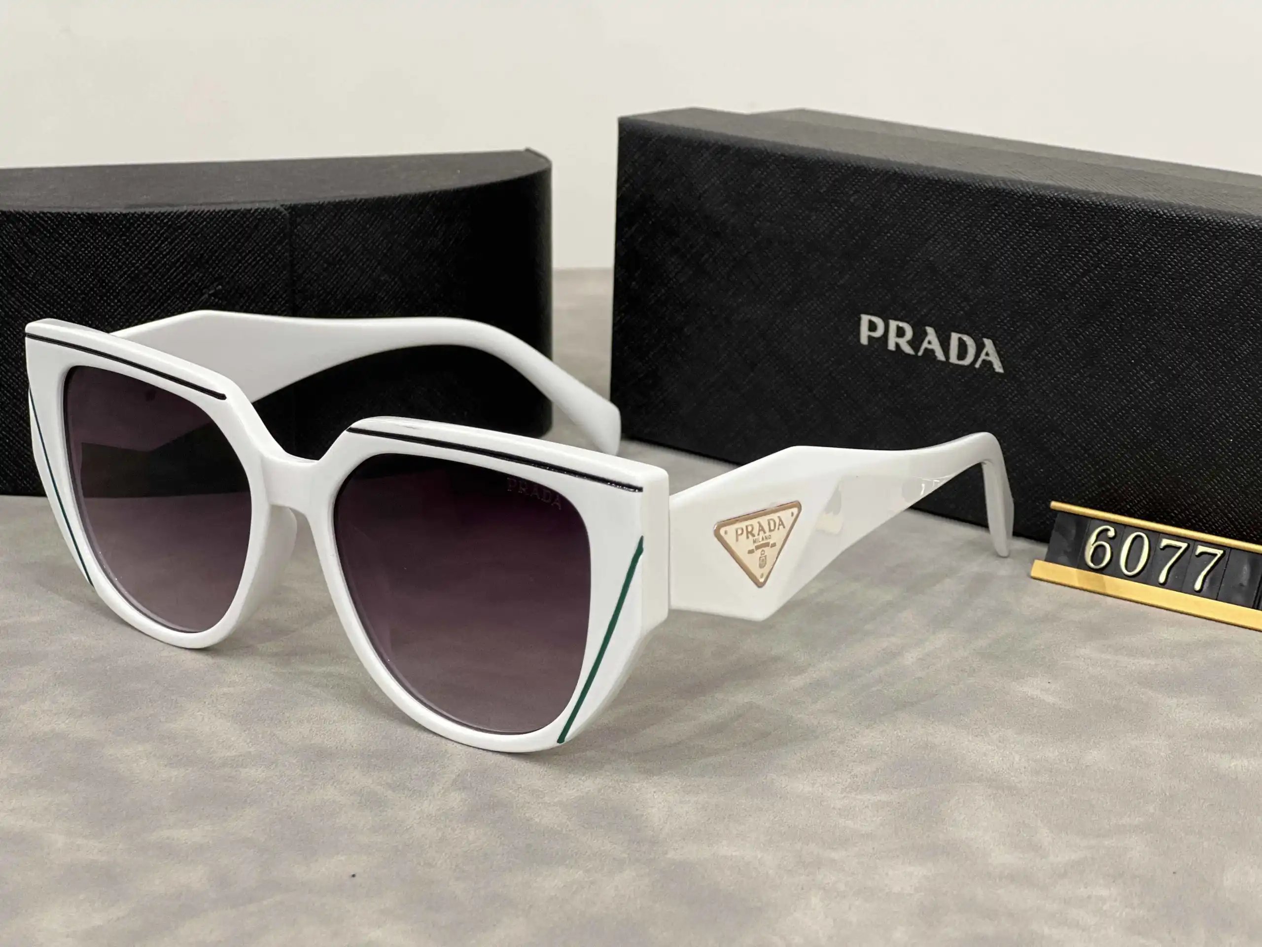 Prada Eyewear Assorted geometric-frame sunglasses with triangle logo plaques — 22