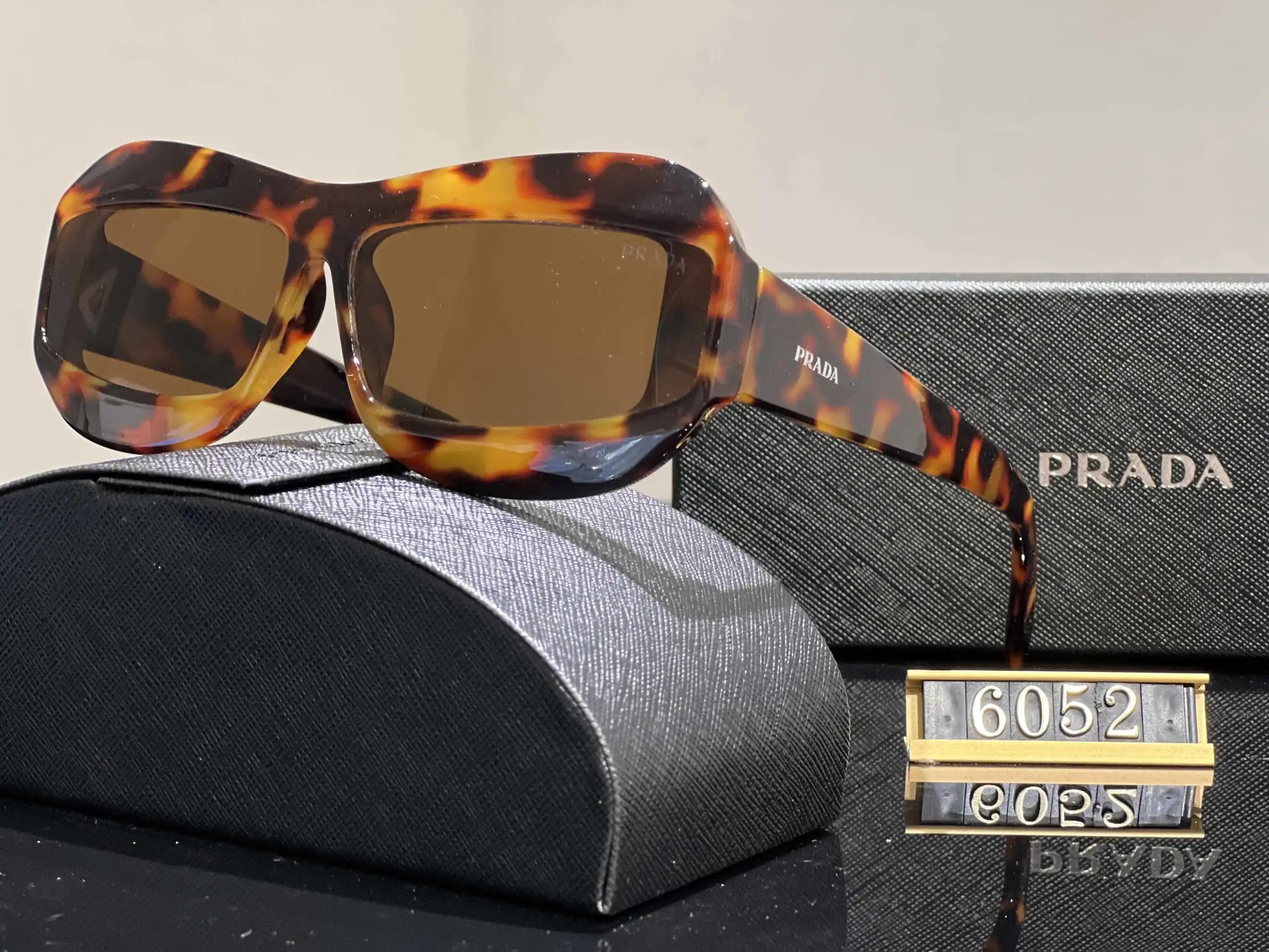 Prada Eyewear Assorted geometric-frame sunglasses with triangle logo plaques — 10