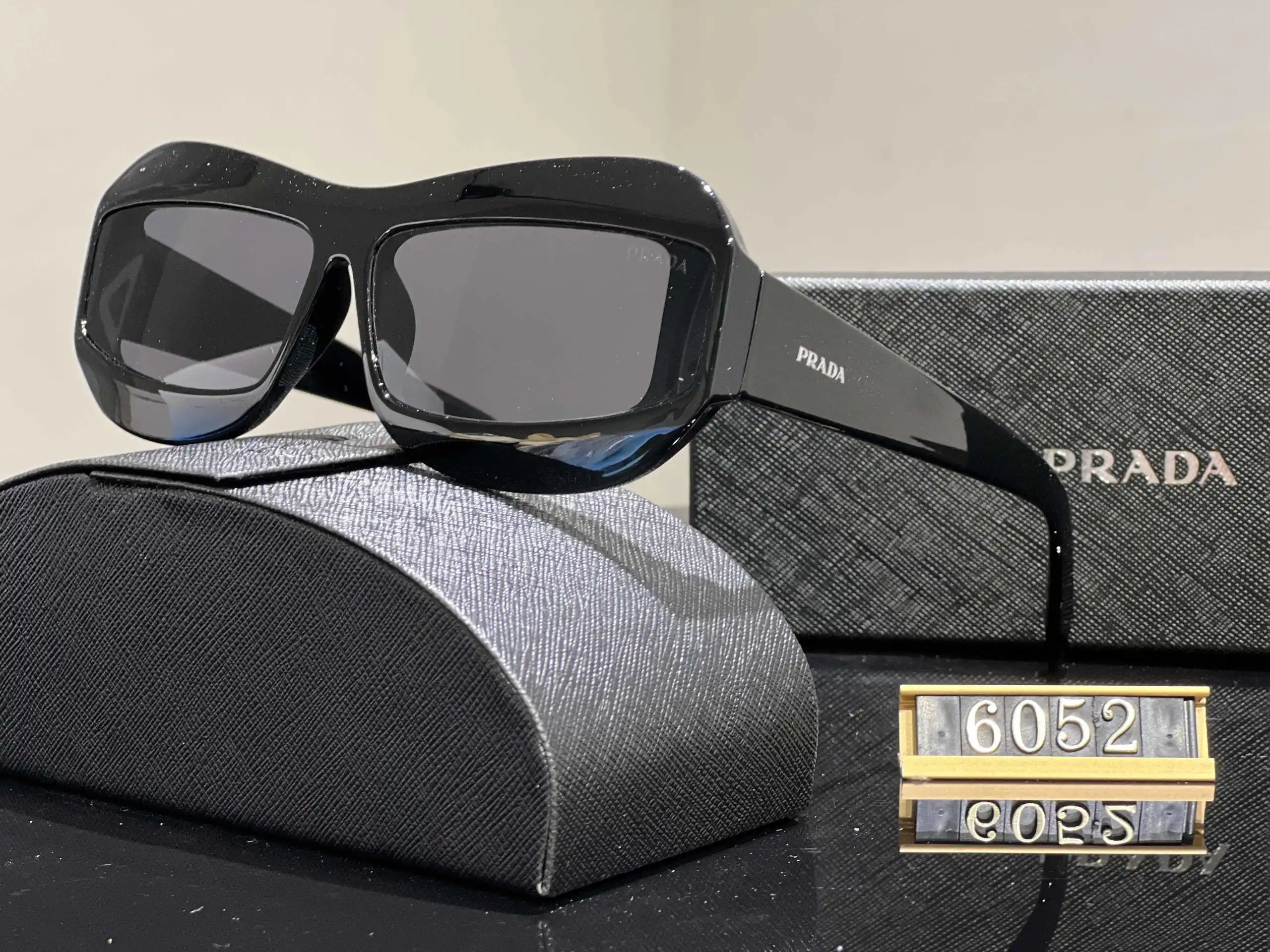 Prada Eyewear Assorted geometric-frame sunglasses with triangle logo plaques — 34