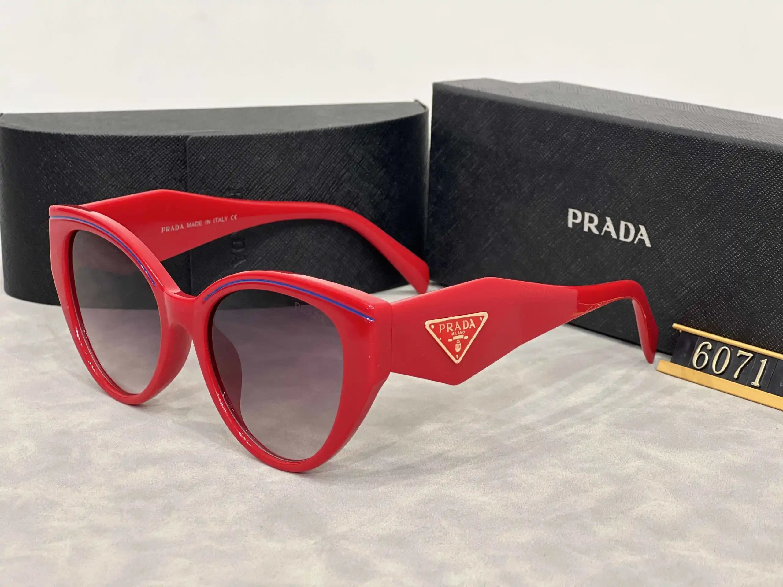 Prada Eyewear Assorted geometric-frame sunglasses with triangle logo plaques — 31